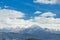 Mountain peak snow clouds blue sky, epirus Ioannina Greece Mitsikeli pea