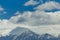 Mountain peak snow clouds blue sky, epirus Ioannina Greece Mitsikeli pea