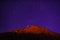 Mountain peak in starry night