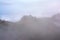 Mountain peaks hiden in the mist in Montserrat, view from Sant Jeroni