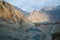 Mountain peaks in Karakoram range near moraine and glacial lake in Passu