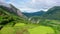 Mountain peaks with rainforest. Tropical trees and palm trees on a hillside.