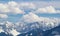 Mountain peaks snow and clouds background