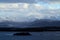 Mountain peaks stand out of the Norwegen water at the beautiful Lofoten islands. A ferry point of view