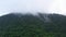 Mountain peaks in a tropical climate. Mountains covered by rainforest, aerial view.