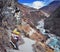 Mountain porter carrying heavy load in Himalayas