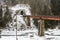 Mountain railway tunnel and railway bridge in Carpathian village Yaremche in winter. Ukraine
