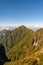 Mountain range with fog and blue sky