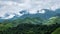 Mountain range inside rainforest park covered by cloud