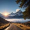 Mountain range with trail in mist and clouds, blue sky with sun in the backgroun...