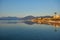 Mountain reflected sunrise in calm sea