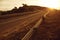 Mountain remote roadway in sunset light