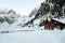 Mountain Rescue Chalet on a valley, surrounded by mountains