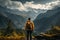 Mountain reverie, man on trek admires view, captured from behind on trail