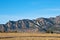 Mountain Ridge Above a Grassy Plain