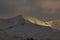 Mountain ridge covered in early mist