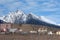 Mountain ridge High Tatras. Slovakia. Panorama of the cloudy blue winter sky above the snow-capped peaks of the High Tatras.