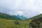 Mountain ridges and meadows scenic cloudy view. Altai Mountains, Russia