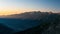 Mountain ridges and peaks illuminated by the sunrise, time lapse. The Alps in summer, Susa Valley, Torino Province, Italy. Sliding