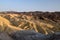 Mountain ridges of Zabriskie Point while setting sun, Death Valley National Park, California, USA