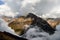 Mountain rising above the clouds in the Annapurna Sanctuary, Himalayas, Nepal.