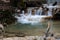 Mountain river in the autumn forest. Streams of water on a long exposure