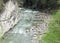 Mountain river, cliff and wooden ferry