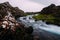 Mountain river among cliffs with clear water in the summer national park of Iceland