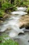 Mountain river falling and flowing trough stone