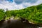 Mountain river flowing along green hills. Lush vegetation landscape