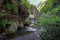 Mountain river in the gorge of mountains near the city of San Pelegrino in Italy