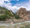 Mountain river and its tributary flowing from the mountain gorge