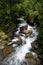 Mountain river landscape in pyrenees, powerful stream of mountain river running down the valley in summer Andorra