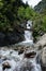 Mountain river landscape in pyrenees, powerful stream of mountain river running down the valley in summer Andorra