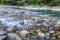 Mountain river with a rapid flow and turquoise water