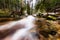 Mountain river, stream, creek with rapids in late autumn, early winter with snow, vintgar gorge, Slovenia