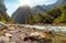 Mountain river at sunrise surrounded with forest at Munsiyari, Uttarakhand, India