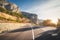 Mountain road and beautiful sky at sunrise. Colorful landscape