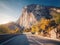 Mountain road and beautiful sky at sunset in autumn