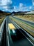 Mountain road with bright blue sky background