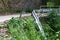 Mountain road with broken fence after car accident, industrial transportation image