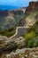 Mountain road and dangerous curve near precipice