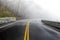 Mountain Road Disappears Into Fog With Copy Space
