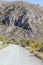 Mountain road with harsh rocky slopes, near Calascio , Abruzzo, Italy