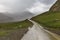 Mountain road in a heavy shower in the spring