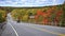 Mountain road. Landscape with rocks, autumn leaf color, and beautiful asphalt road in autumn. High angle view