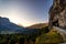 Mountain road leading to a tunnel with Cortina d `Ampezzo in a valley