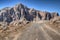 Mountain road passing rugged rocky cliffs