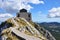 Mountain road to ancient mausoleum. Beautiful scenic landscape. Stairs to heaven concept