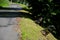 Mountain road with traditional white stone bollards with a black stripe. Old stone pillars of granite stone perched on the lawn by